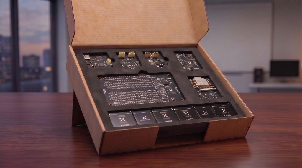 NEXE Launch Kit open box with snap-in modules arranged in custom foam inserts on a desk